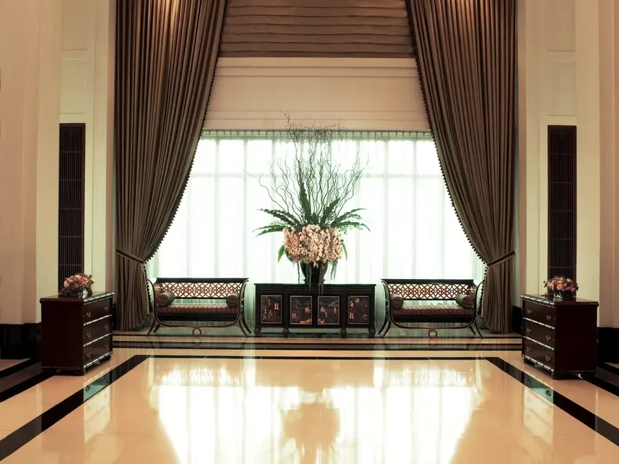 Custom drapery framing a window at a luxury hotel in Bangkok.