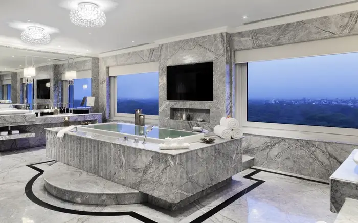Roller shades in an all-marble bathroom at the Palace.