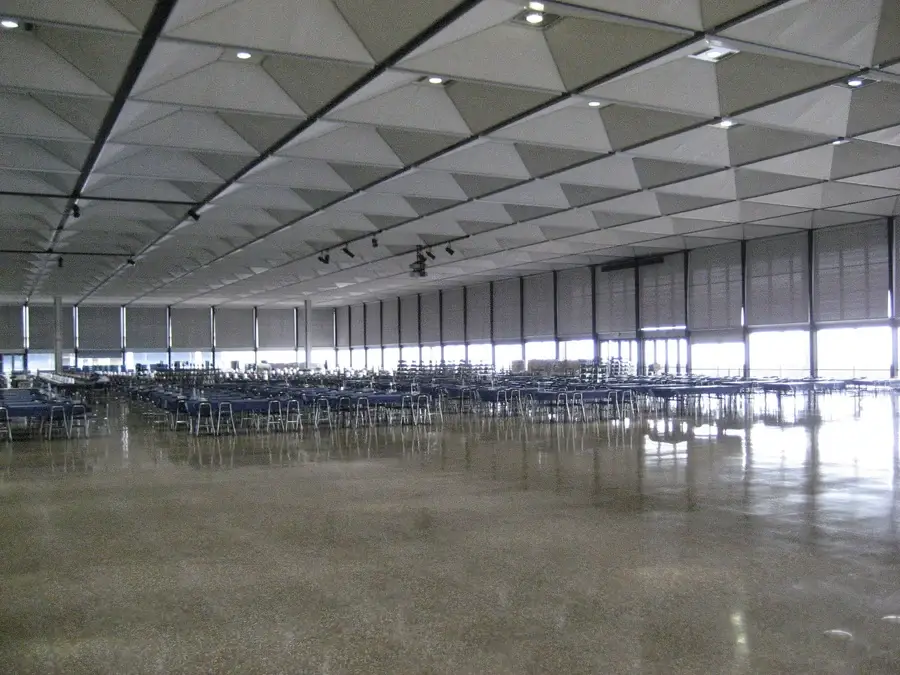 USAF dining hall with custom roller shading surrounding the dining area.