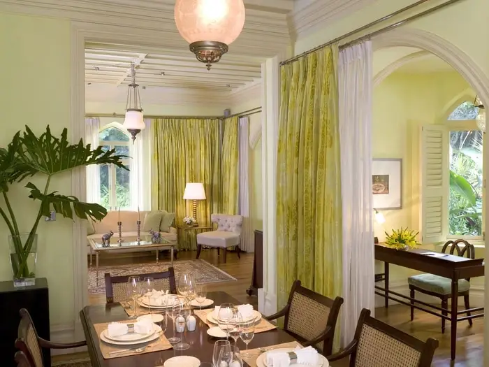 Dining room at the Taj West End Hotel with green custom drapery.