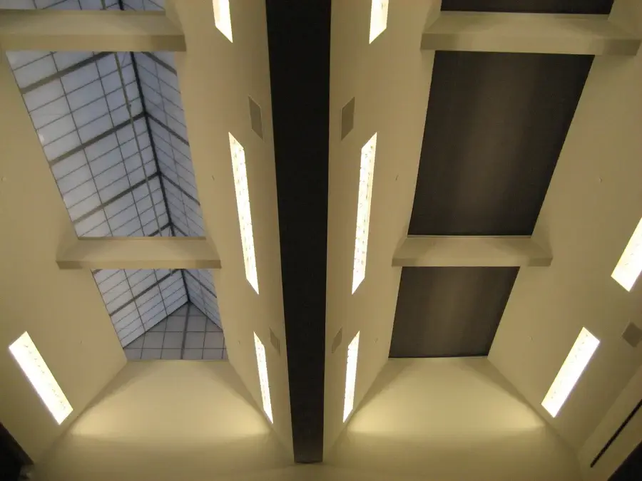Skylight in a hotel being covered by a custom skylight shading solution.