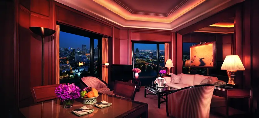 Low-lit suite at a Bangkok hotel at dusk. Drapery by BTX provides privacy.