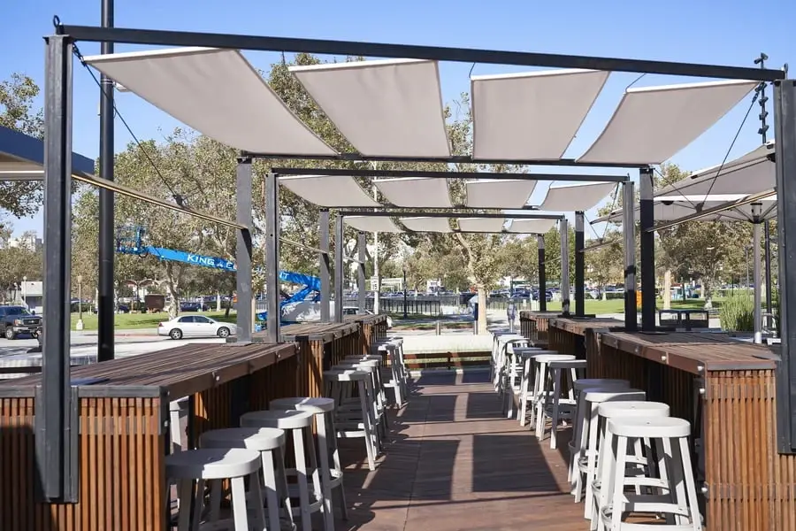 Patio shades covering the outdoor seating area of a restaurant.